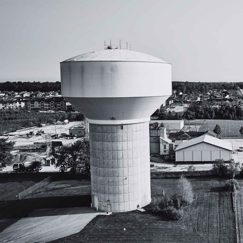 Municipal water tower representing water utility billing, meter management, and customer account services