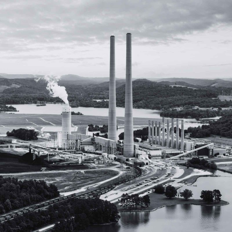 Power generation facility with utility infrastructure, transmission equipment, and industrial systems